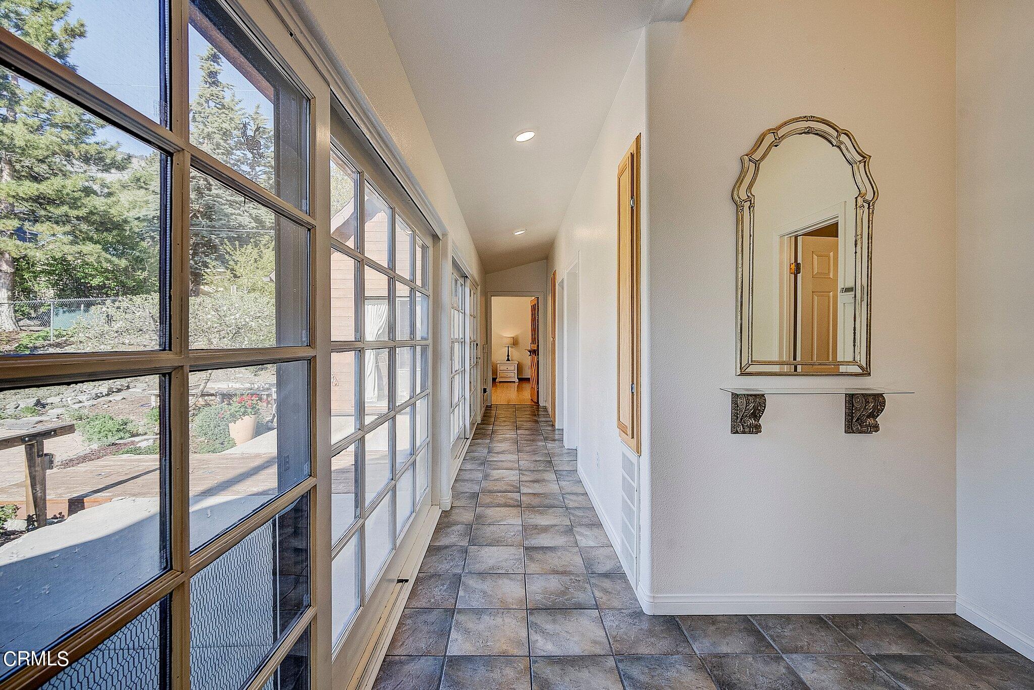 5390 Locarno Drive Wrightwood, CA 92397 - Photo 14 of 33 a view of a hallway with wooden floor and entryway