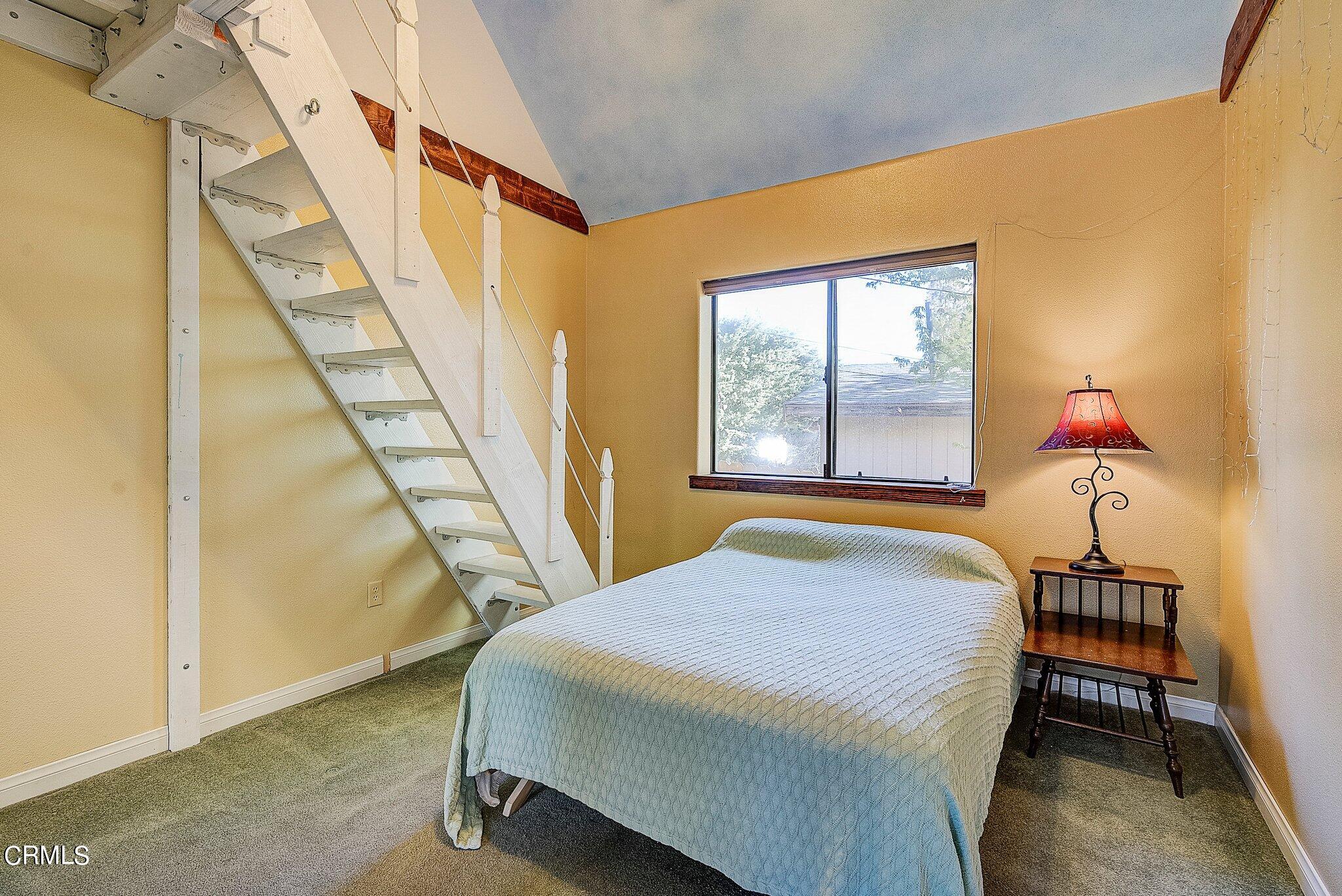 5390 Locarno Drive Wrightwood, CA 92397 - Photo 15 of 33 a bedroom with a bed and a window