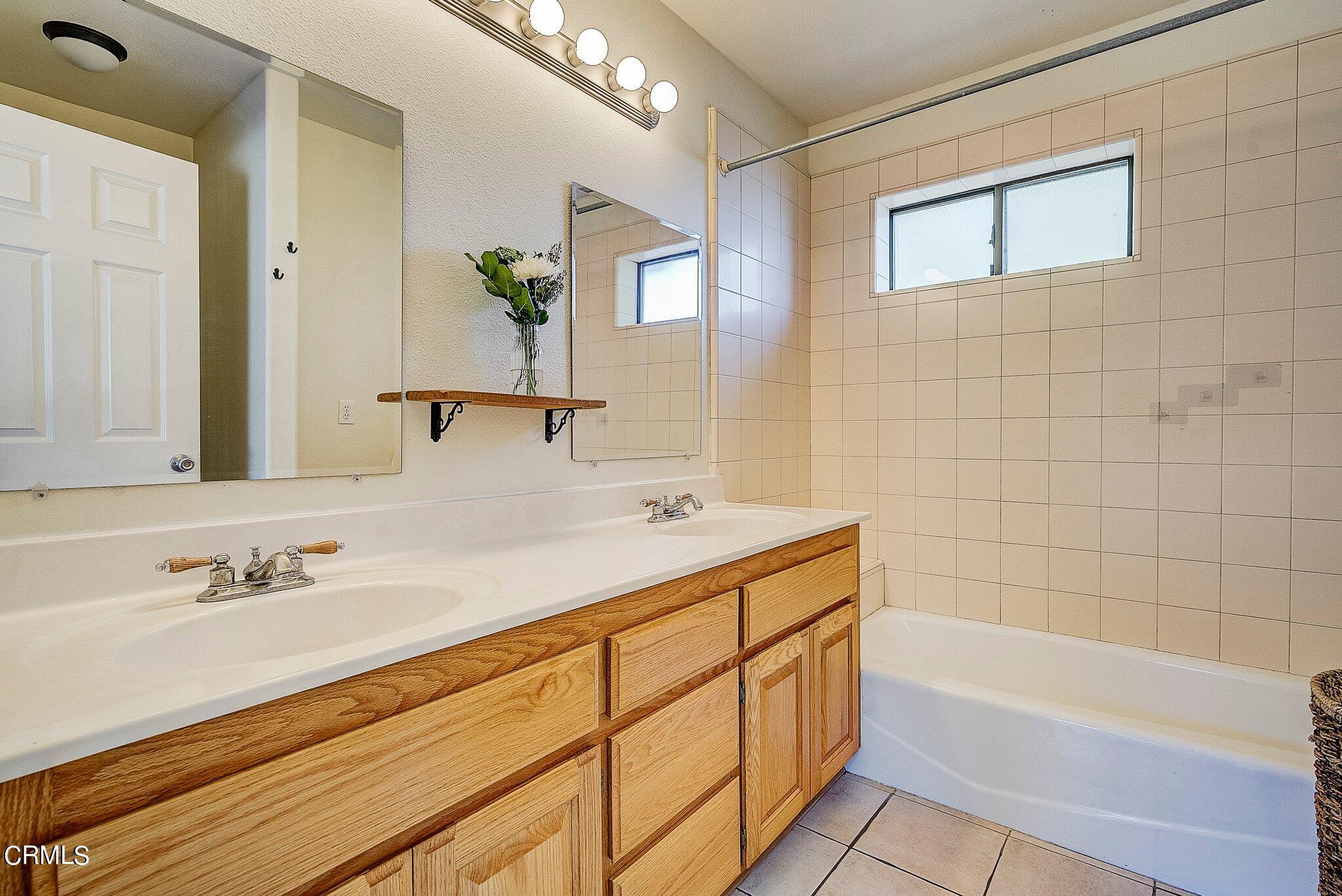 5390 Locarno Drive Wrightwood, CA 92397 - Photo 18 of 33 a bathroom with a tub sink and mirror