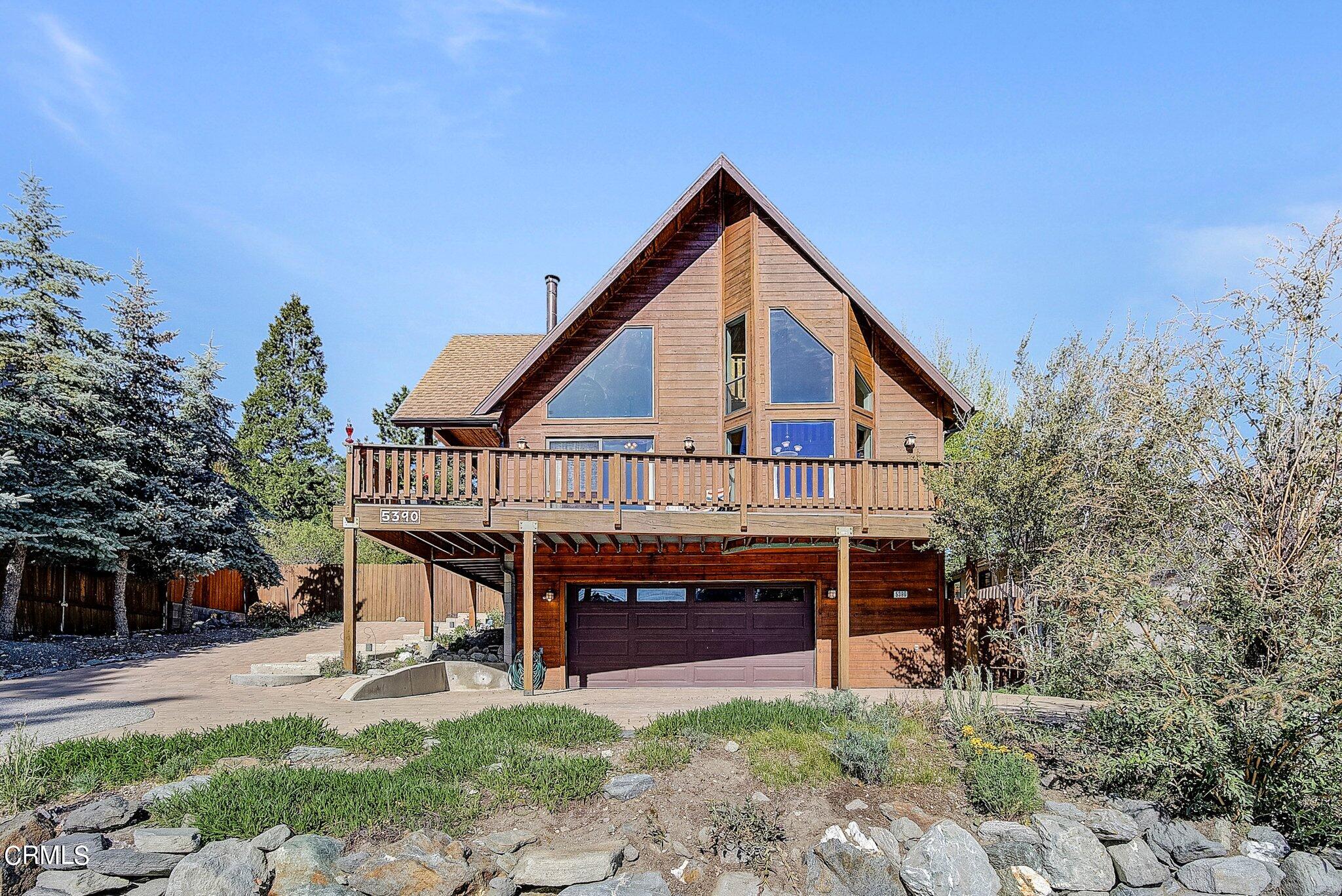 5390 Locarno Drive Wrightwood, CA 92397 - Photo 2 of 33 a view of house with sitting area and garden