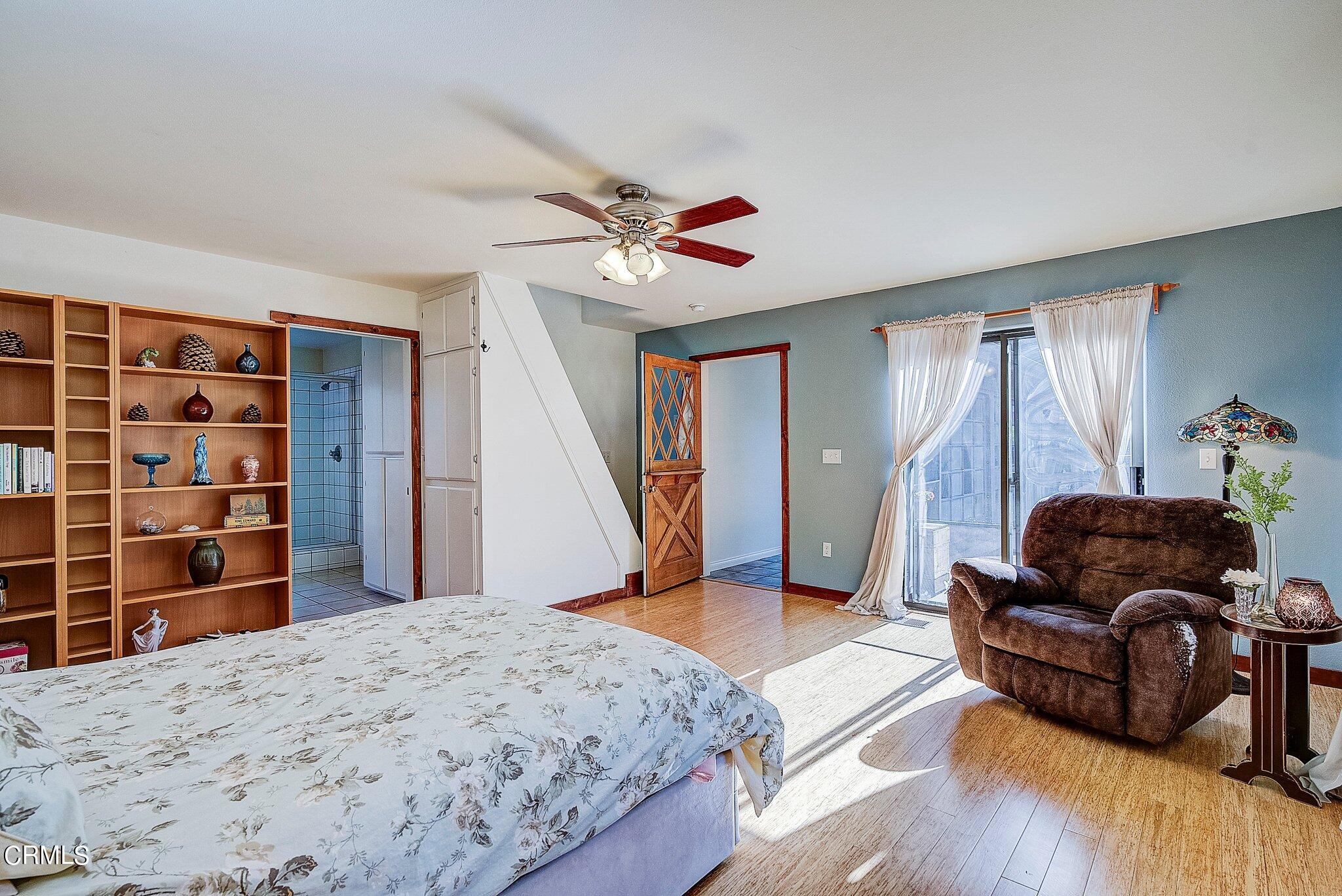 5390 Locarno Drive Wrightwood, CA 92397 - Photo 23 of 33 a bedroom with a bed and wooden floor