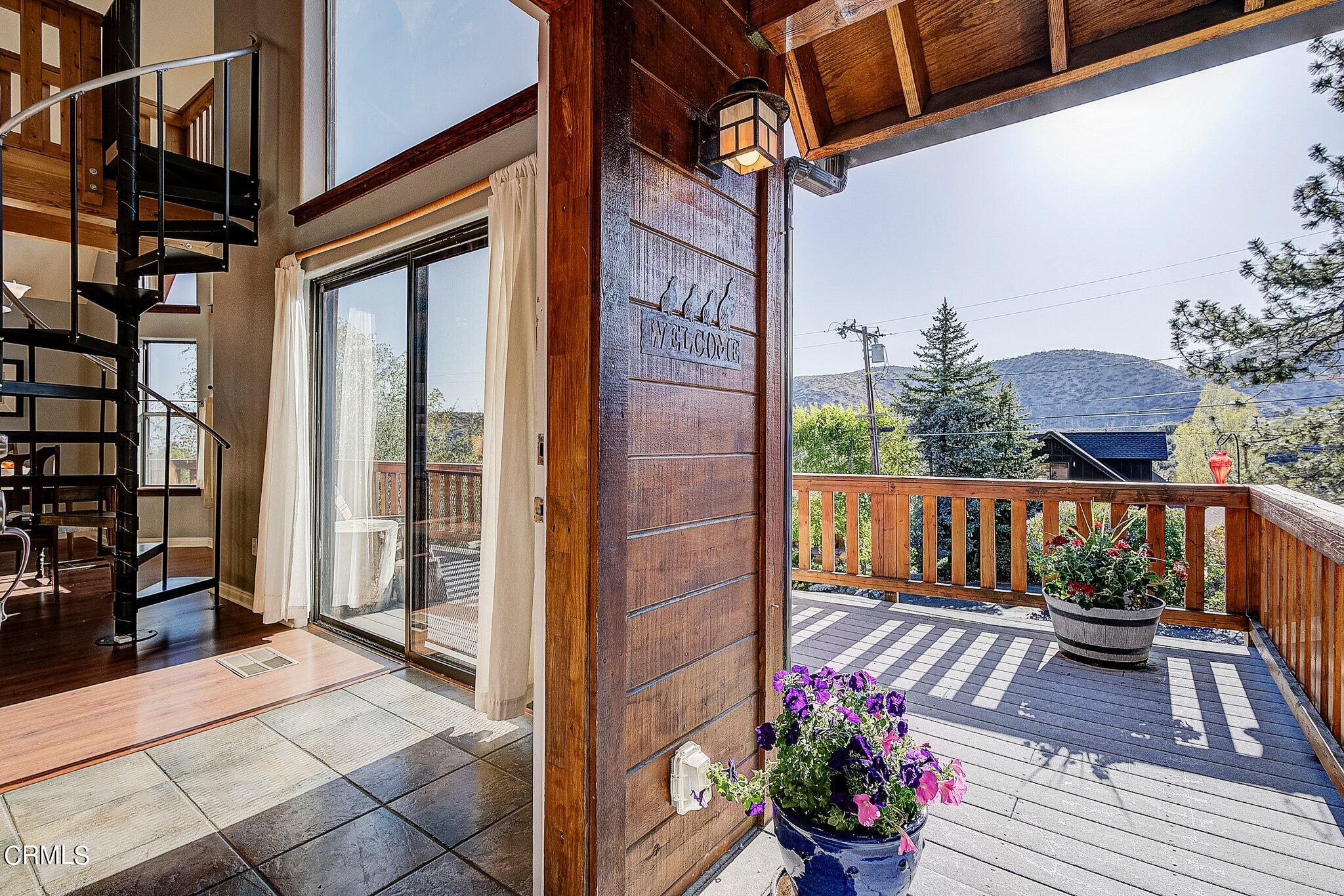5390 Locarno Drive Wrightwood, CA 92397 - Photo 30 of 33 a view of a balcony with wooden floor