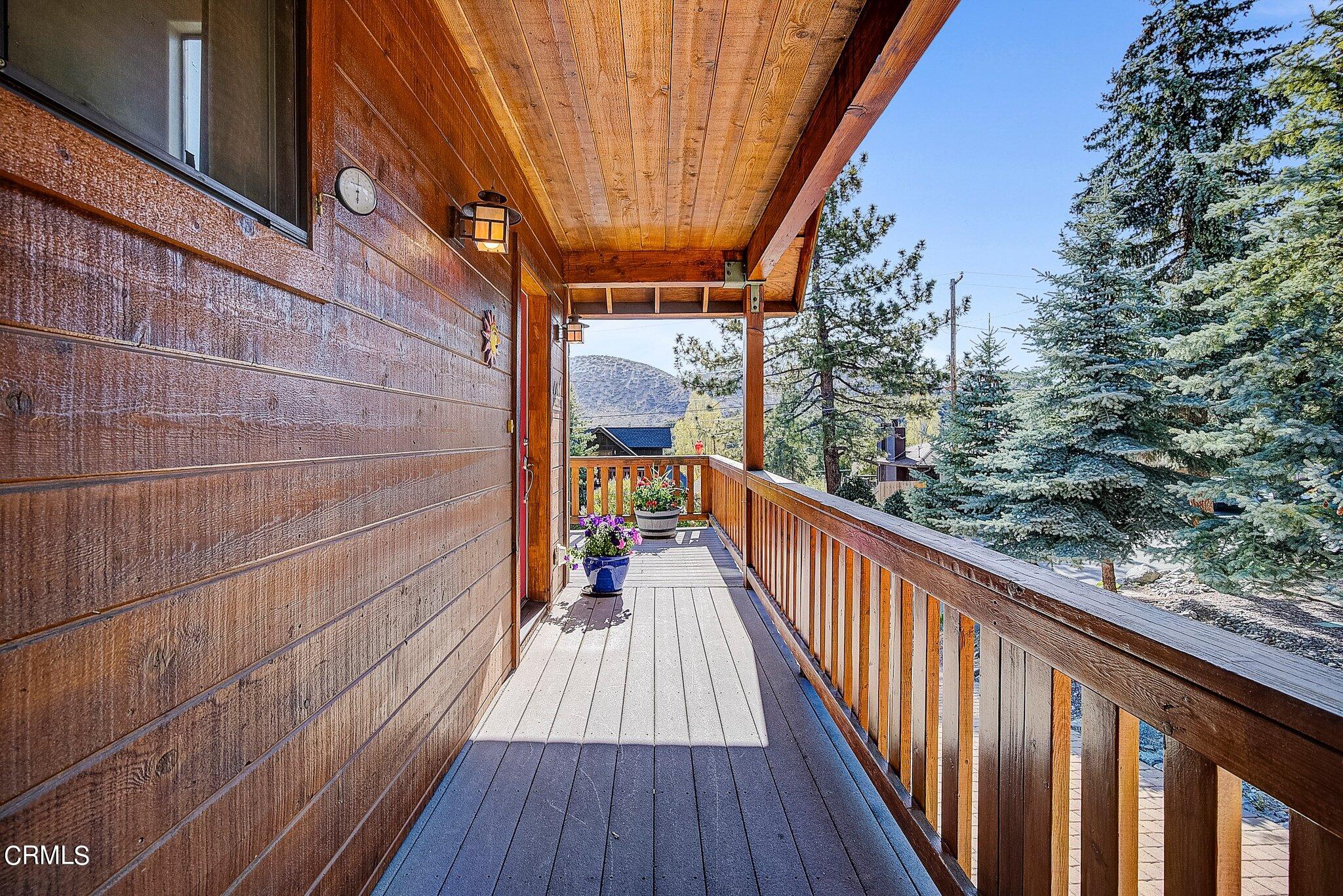 5390 Locarno Drive Wrightwood, CA 92397 - Photo 3 of 33 a view of balcony with wooden floor