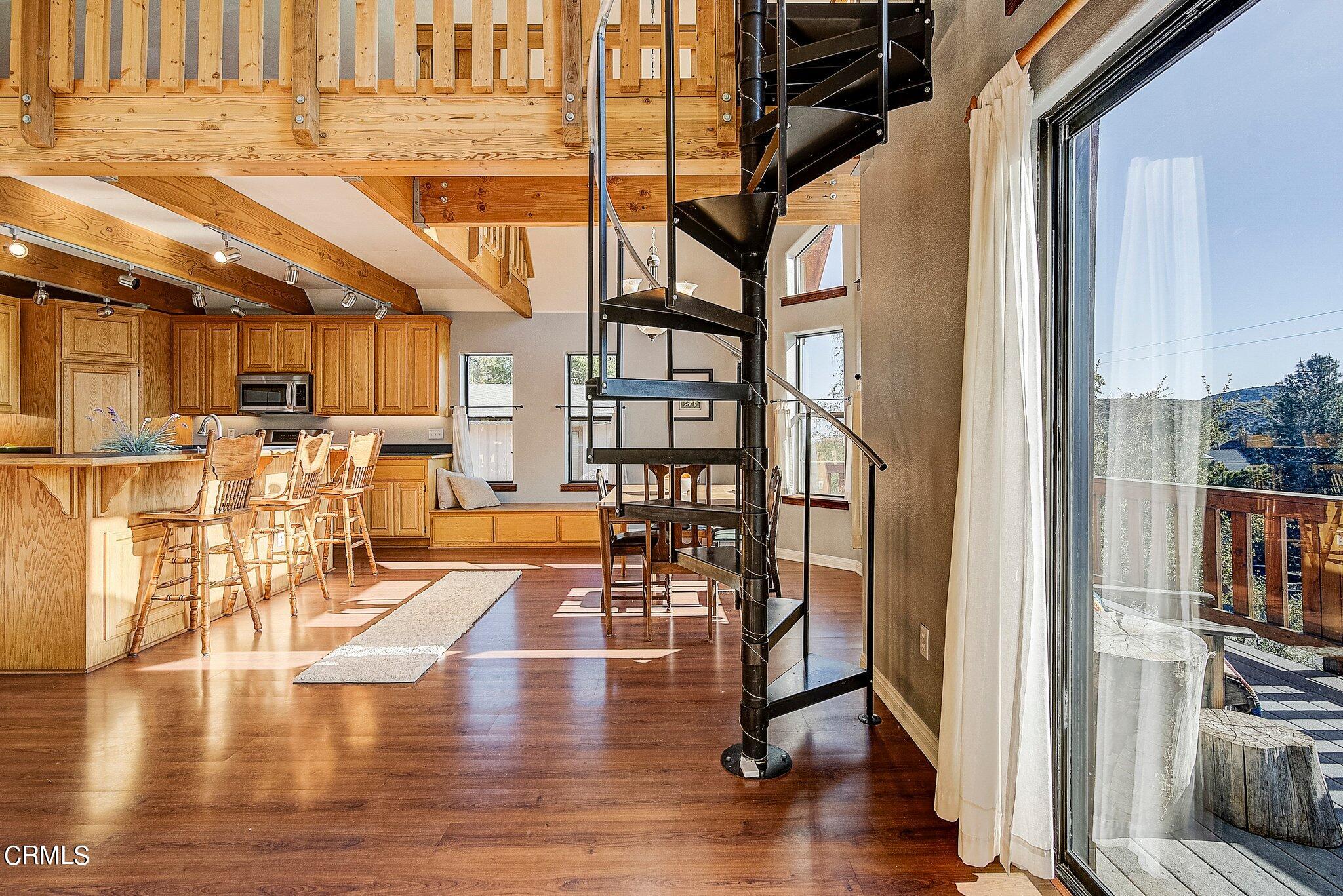 5390 Locarno Drive Wrightwood, CA 92397 - Photo 5 of 33 a view of a living room with kitchen view and appliances