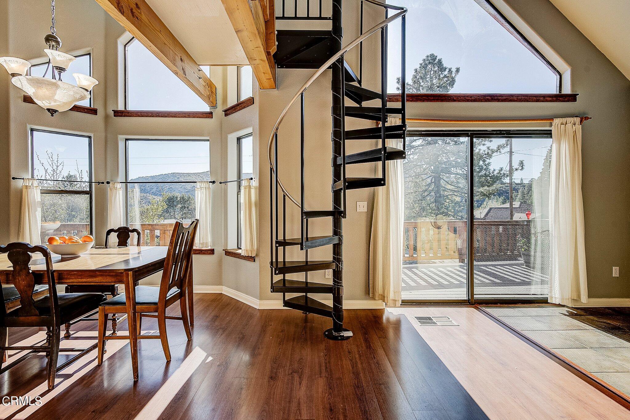 5390 Locarno Drive Wrightwood, CA 92397 - Photo 9 of 33 a dining room with wooden floor and furniture