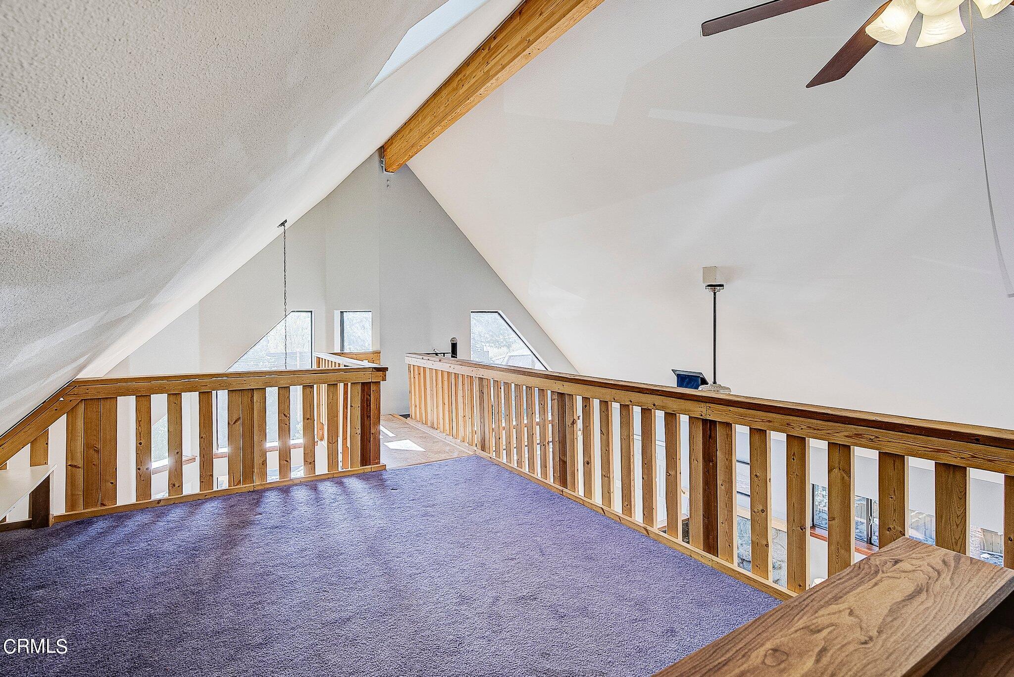 5390 Locarno Drive Wrightwood, CA 92397 - Photo 10 of 33 a view of staircase with railing and a rug