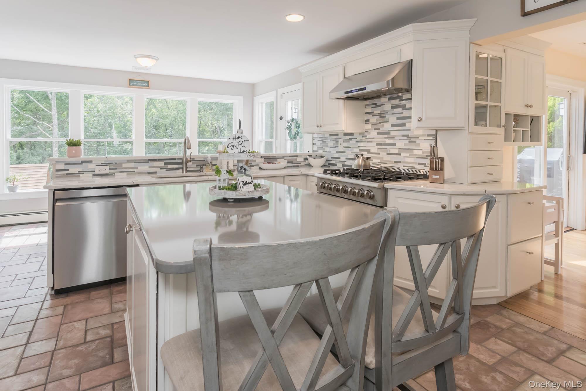 102 Beverly Road Chester, NY 10918 - Photo 7 of 49 a kitchen with stainless steel appliances granite countertop table chairs stove and sink