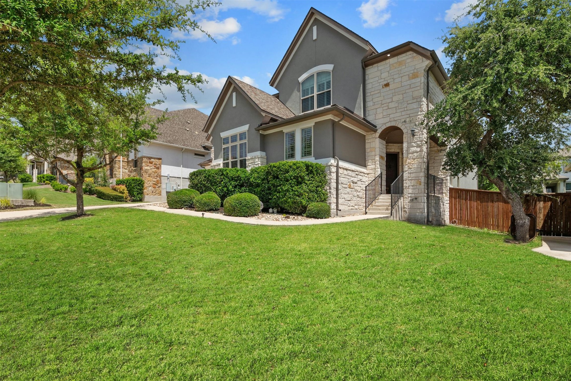 16025 La Rosa Drive Austin, TX 78738 - Photo 1 of 1 The front of the home features beautifully maintained landscaping, enhancing the home’s overall curb appeal