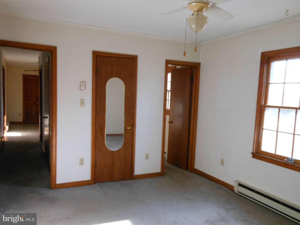 15140 Sheads Mountain Road Rixeyville, VA 22737 - Photo 11 of 12 a view of an empty room with window and cabinet