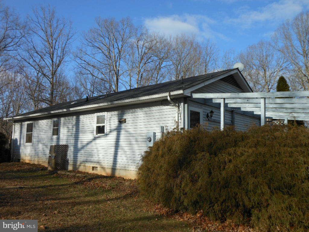 15140 Sheads Mountain Road Rixeyville, VA 22737 - Photo 4 of 12 a house that has a tree in front of it