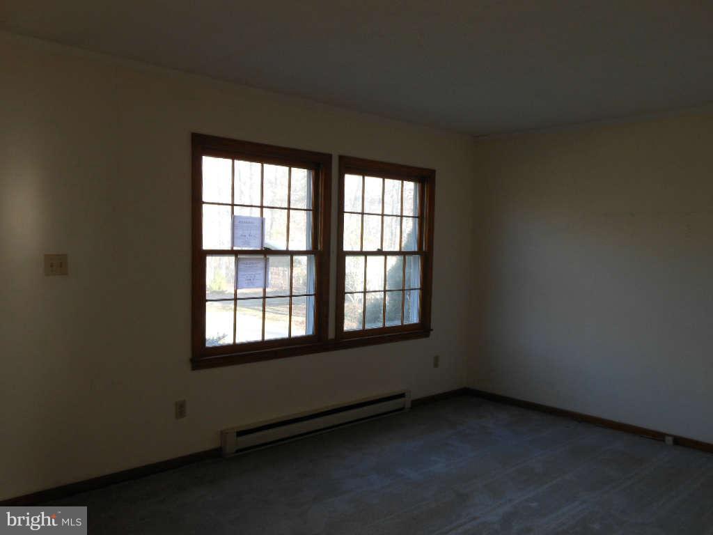 15140 Sheads Mountain Road Rixeyville, VA 22737 - Photo 5 of 12 an empty room with a window