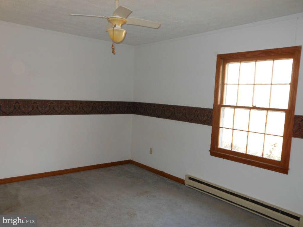 15140 Sheads Mountain Road Rixeyville, VA 22737 - Photo 9 of 12 a view of an empty room with a window