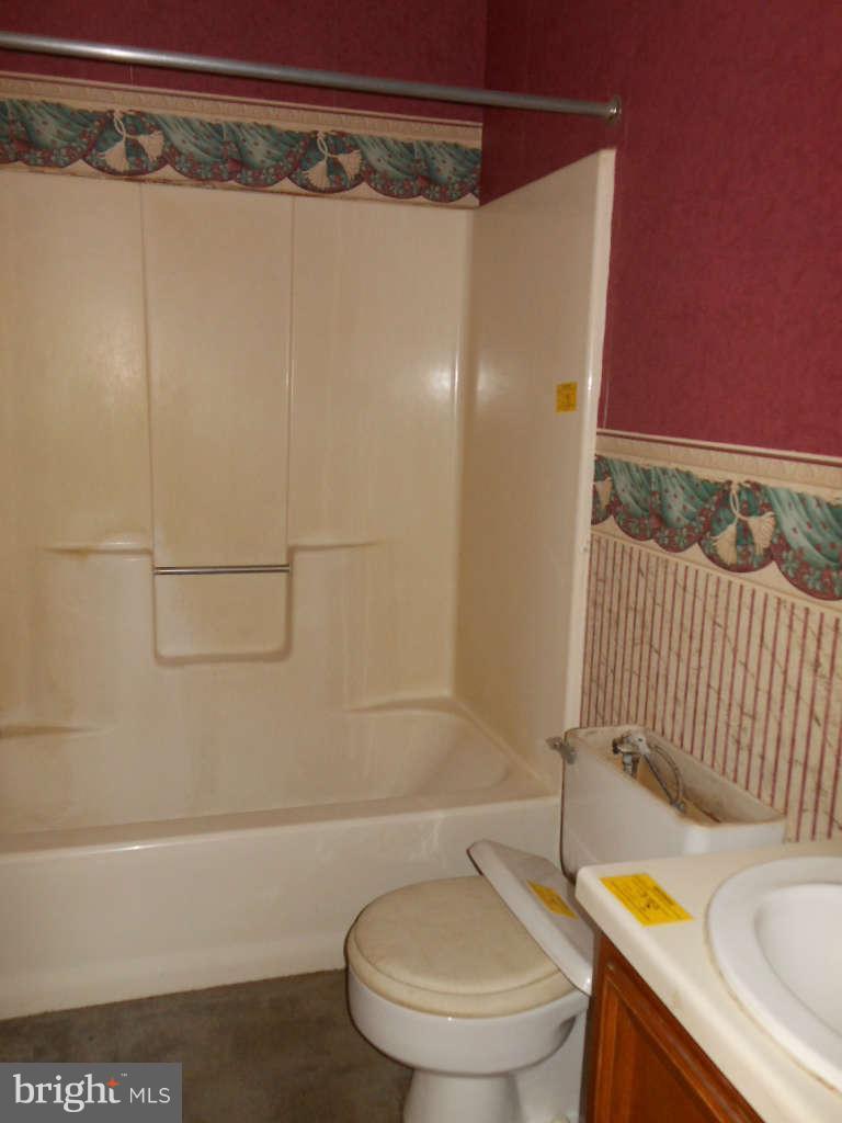 15140 Sheads Mountain Road Rixeyville, VA 22737 - Photo 10 of 12 a bathroom with a sink and bathtub