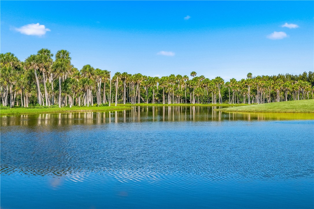 2350 Quay Dock Road Vero Beach, FL 32967 - Photo 33 of 35 a view of a lake with houses in the background