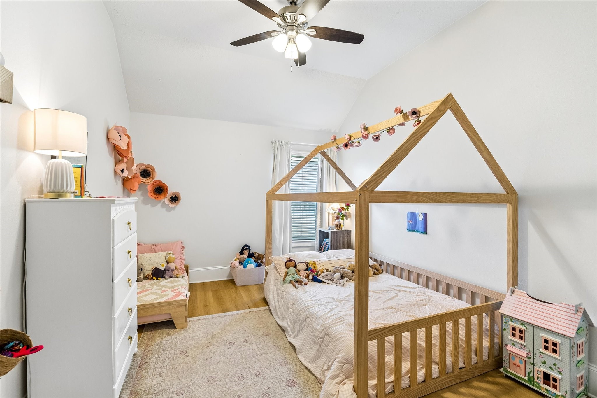 31306 Brighton Brook Lane Spring, TX 77386 - Photo 27 of 34 Bright secondary bedroom featuring vaulted ceilings, abundant natural light, and a cozy, welcoming feel.
