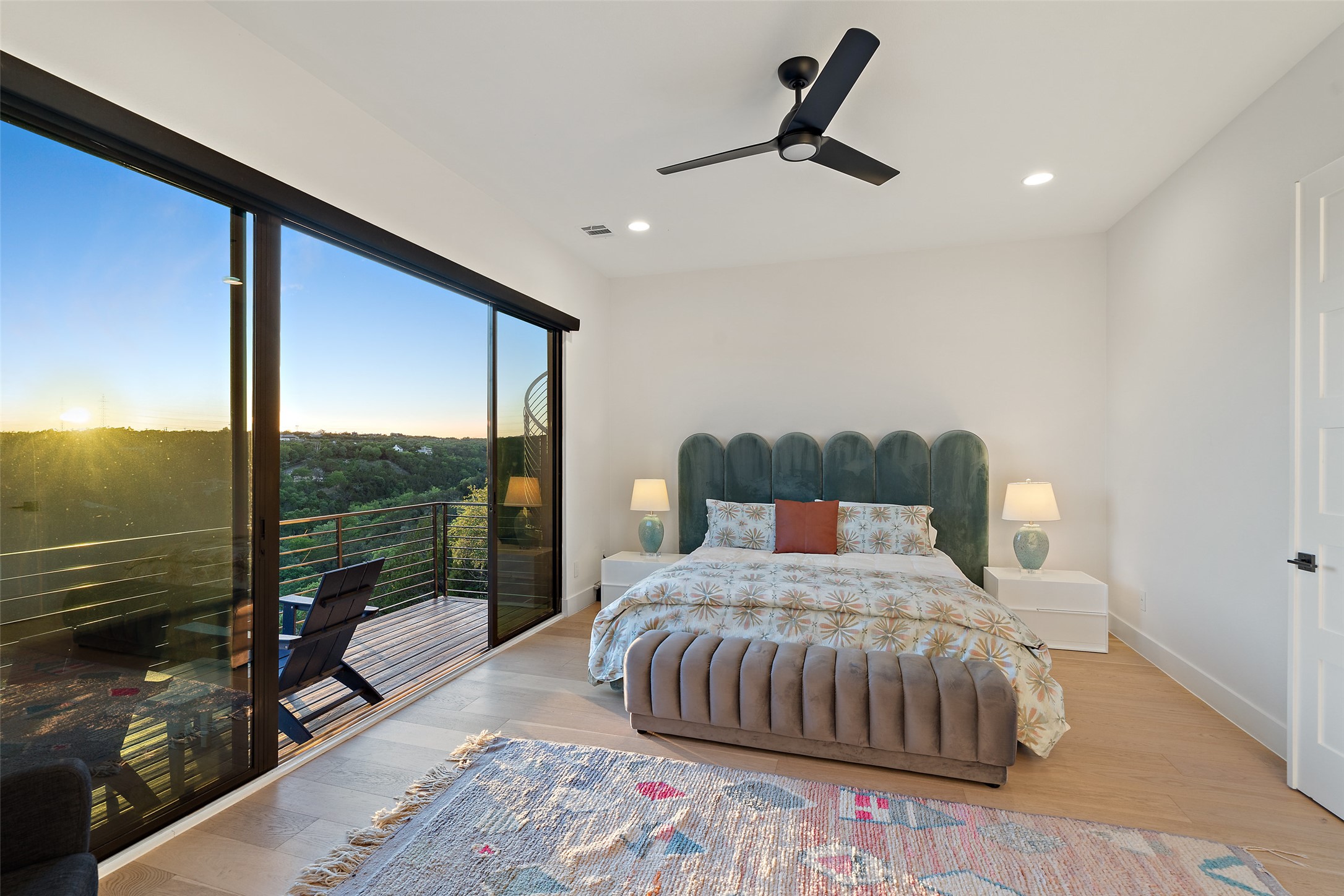 14417 Cochise Trail Austin, TX 78734 - Photo 19 of 40 a bedroom with a bed a large window with outer view