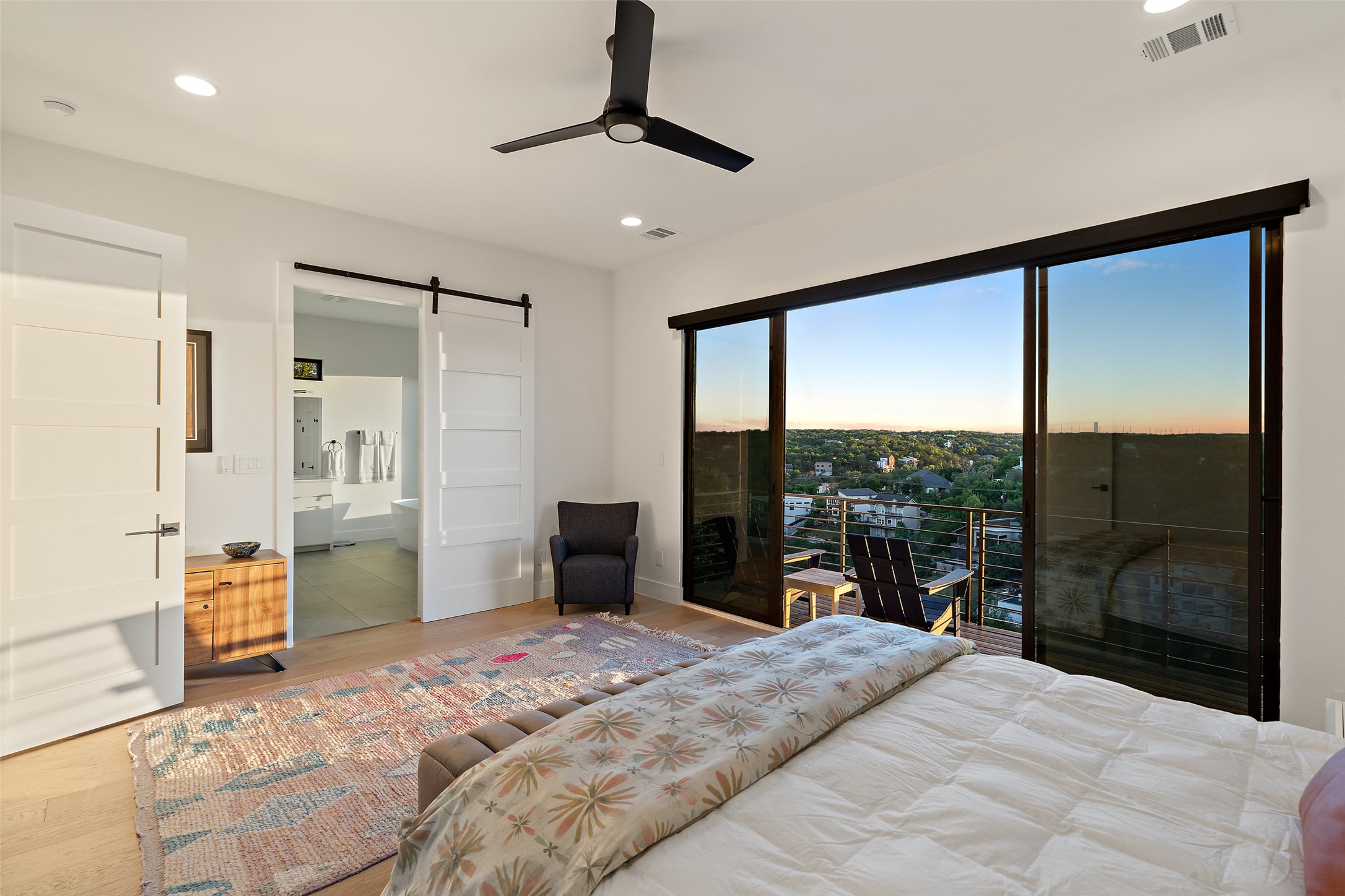 14417 Cochise Trail Austin, TX 78734 - Photo 20 of 40 a bedroom with a large bed and a large window