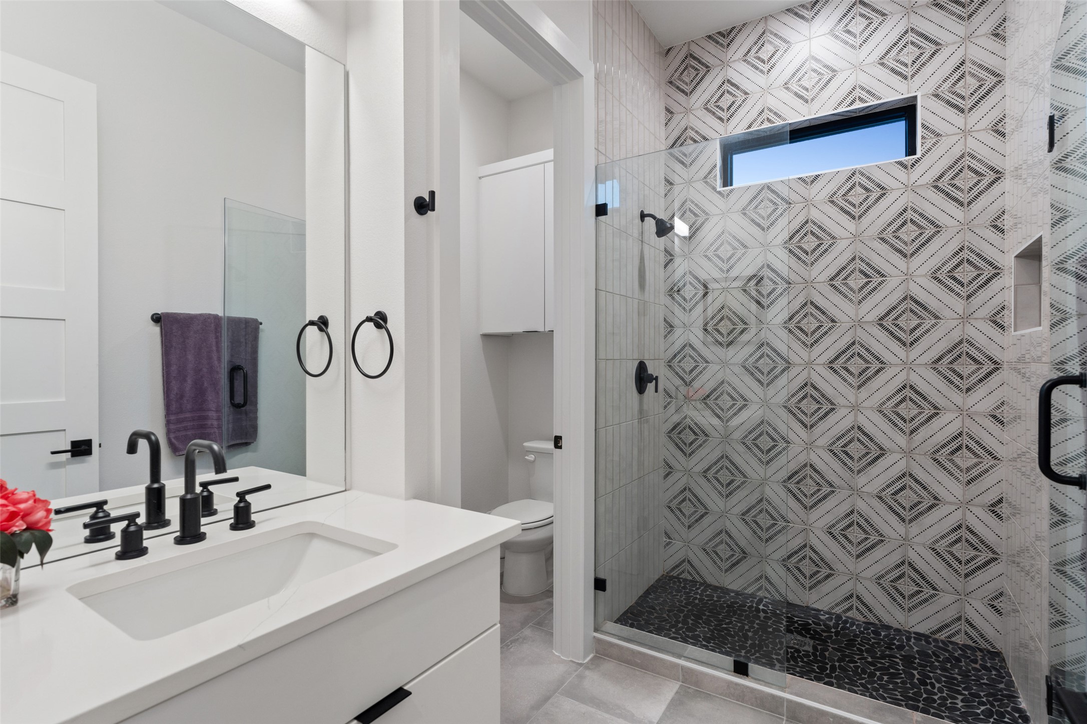 14417 Cochise Trail Austin, TX 78734 - Photo 26 of 40 a bathroom with a sink mirror and a shower