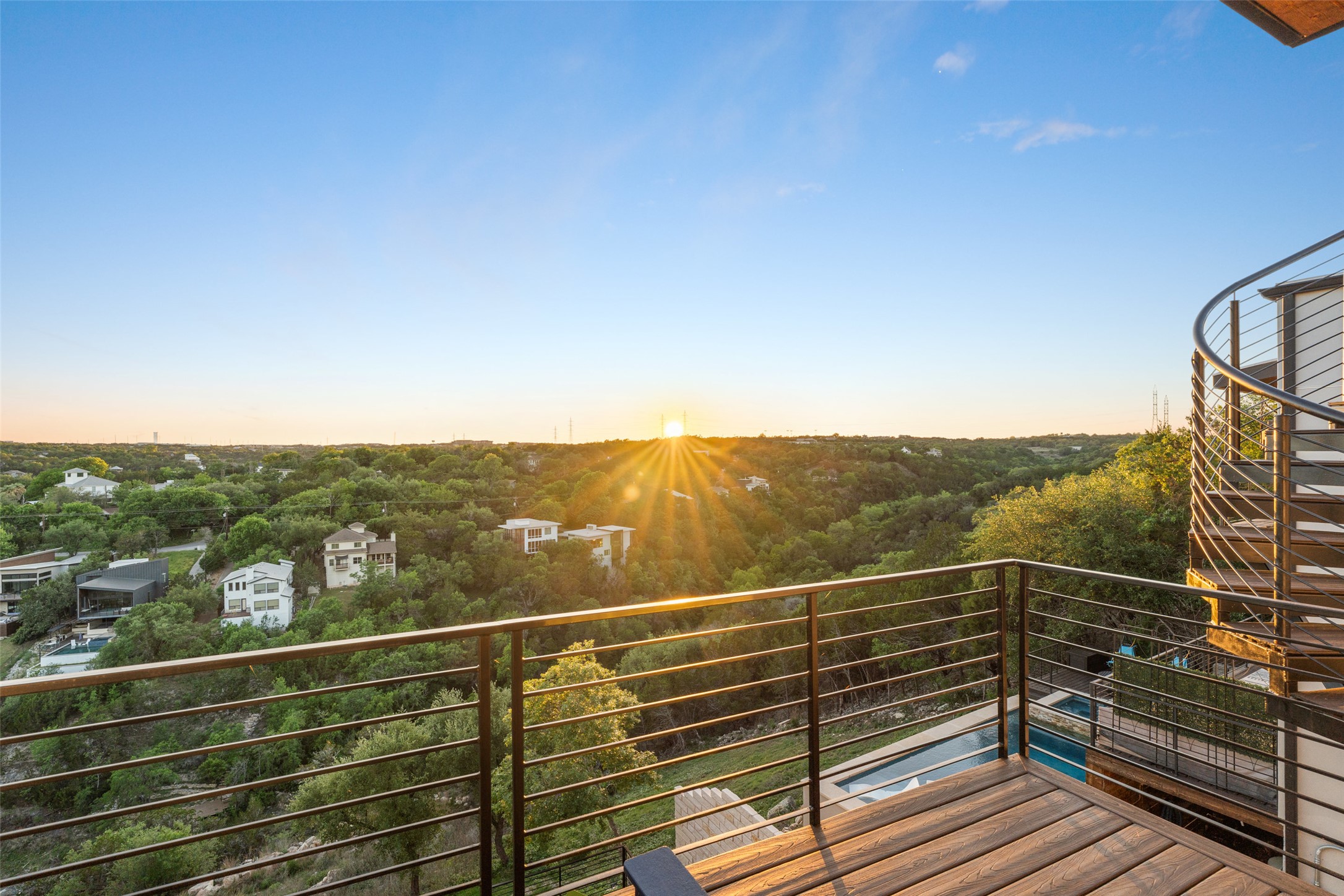 14417 Cochise Trail Austin, TX 78734 - Photo 34 of 40 a view of a balcony with a floor to ceiling window and stairs