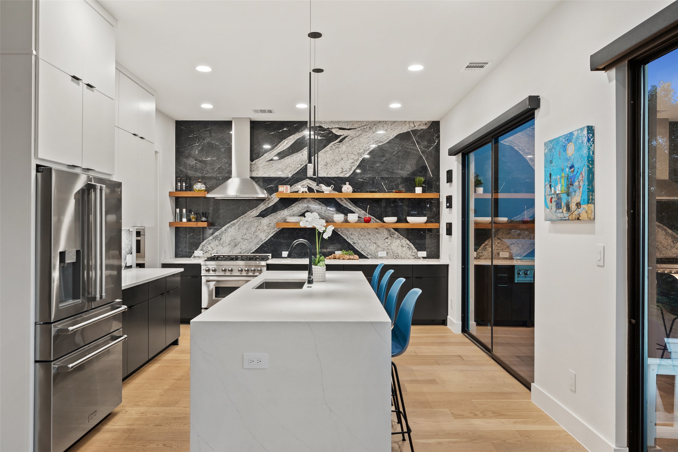 14417 Cochise Trail Austin, TX 78734 - Photo 5 of 40 a view of a kitchen with a sink and refrigerator