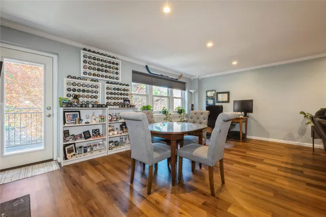 a view of a dining room with furniture and wooden floor