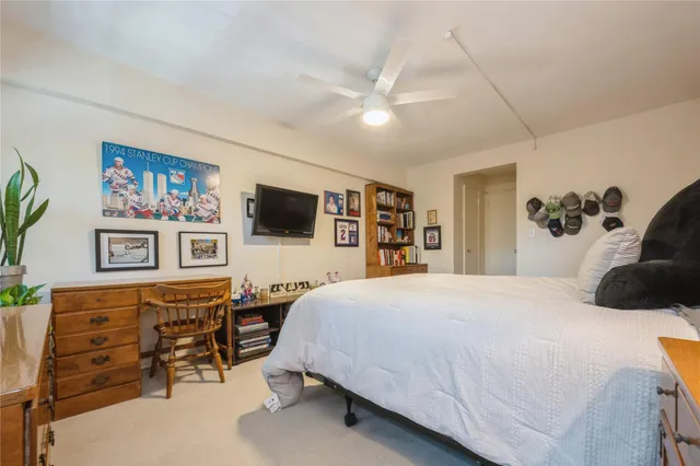 a bathroom with a granite countertop sink a toilet and bathtub