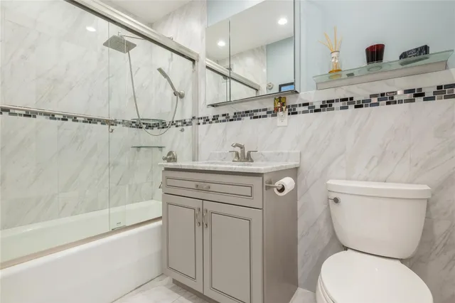 a view of a balcony with table and chairs