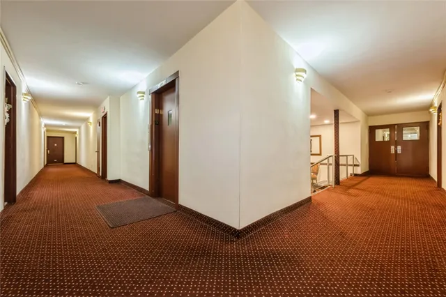 a view of parking garage with cars