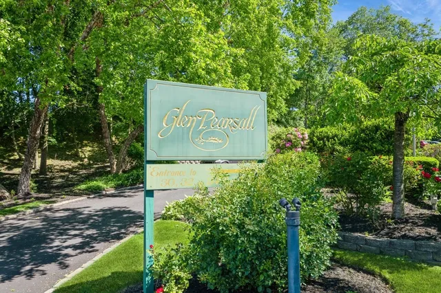 a picture of a bench in front of a wall