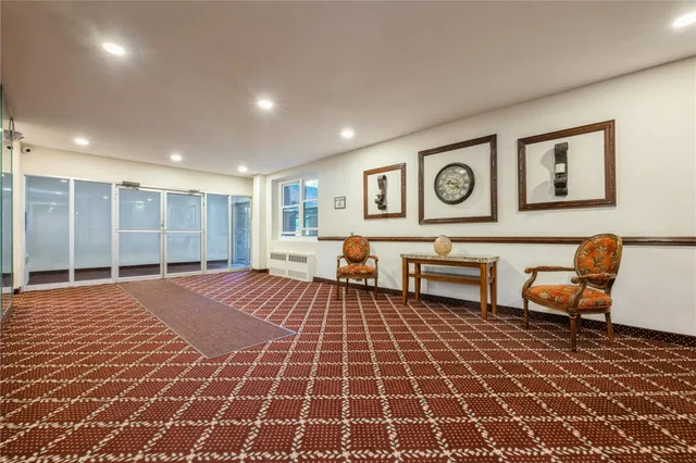 a spacious bedroom with a bed and table