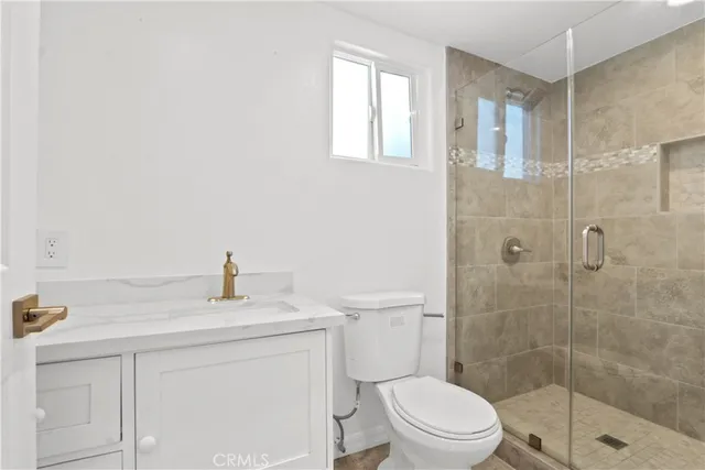 a view of a house with a yard and potted plants