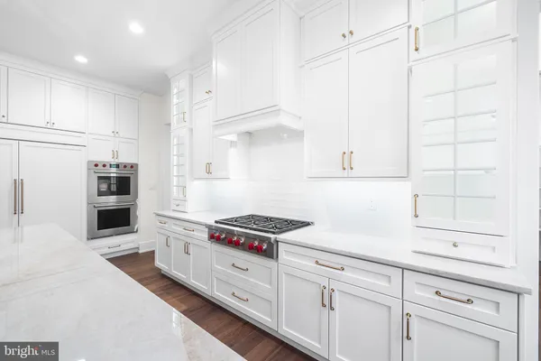 a kitchen with cabinets and appliances
