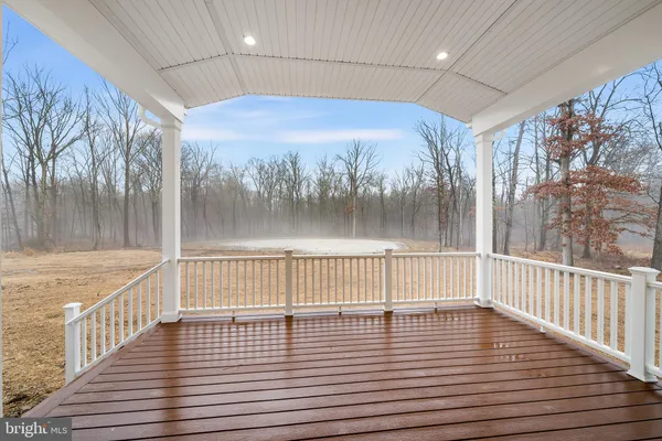 a view of deck with wooden floor and fence