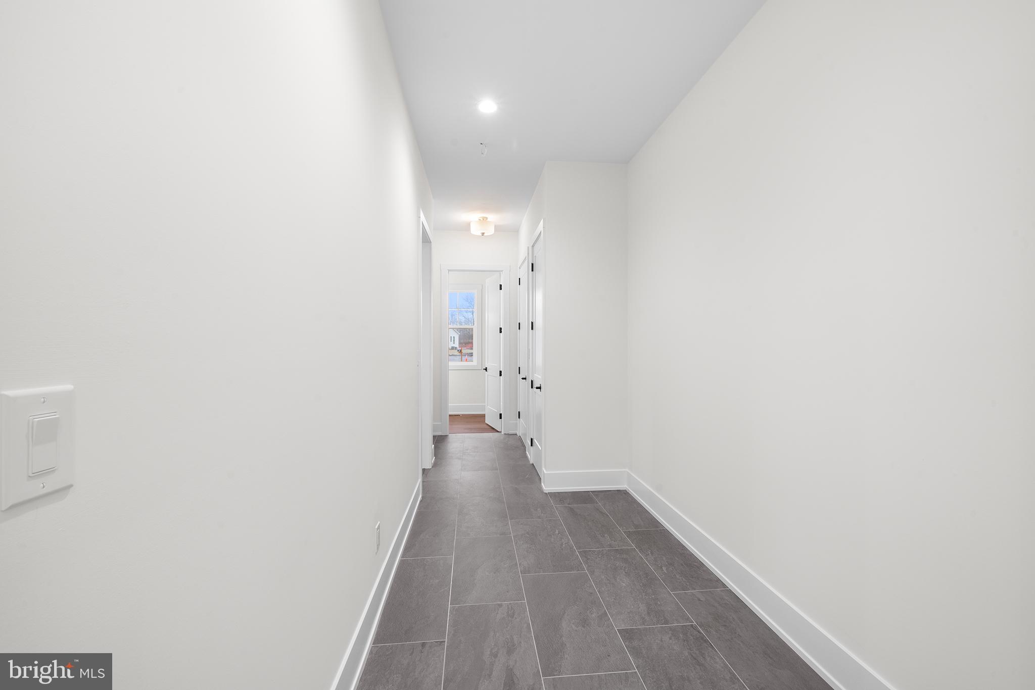 315 Old Limekiln Road Chalfont, PA 18914 - Photo 17 of 39 a view of a hallway with wooden floor