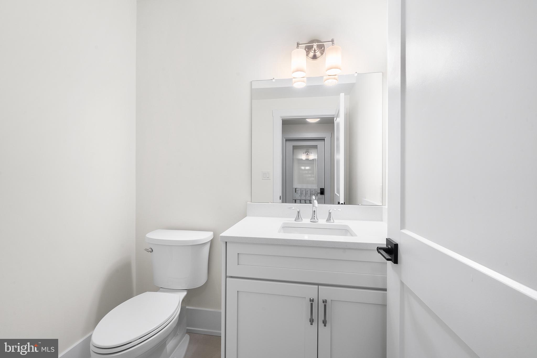 315 Old Limekiln Road Chalfont, PA 18914 - Photo 18 of 39 a bathroom with a sink a toilet and mirror
