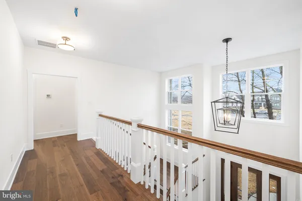 a view of a hallway with windows