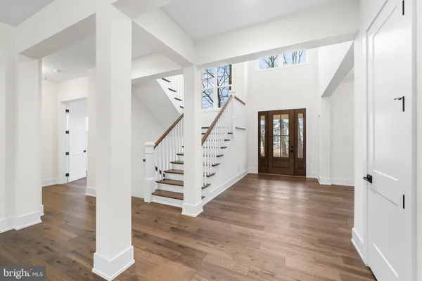 a view of entryway with stairs and wooden floor