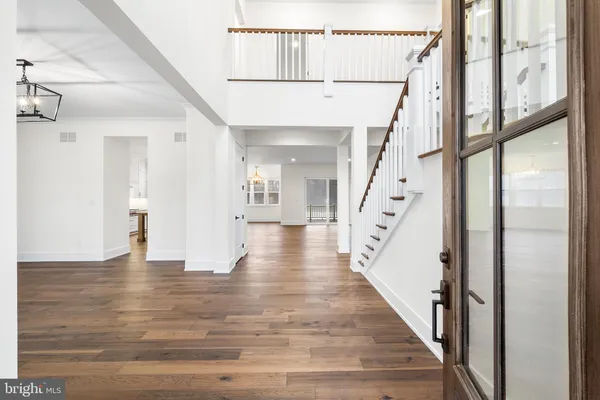 a view of an entryway with wooden floor