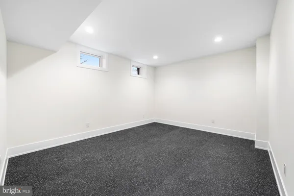 an empty room with a empty space and window