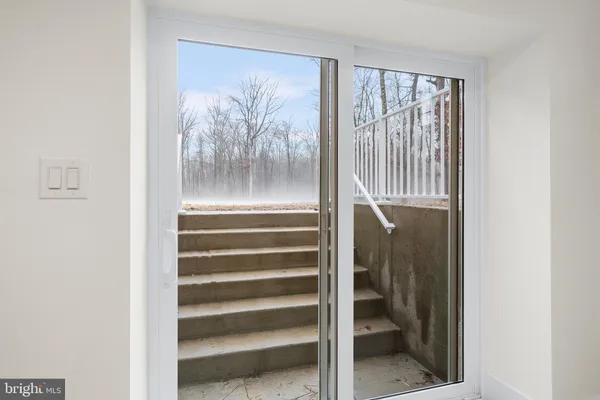 a view of entryway with a front door