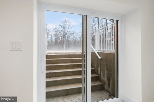 a view of entryway with a front door