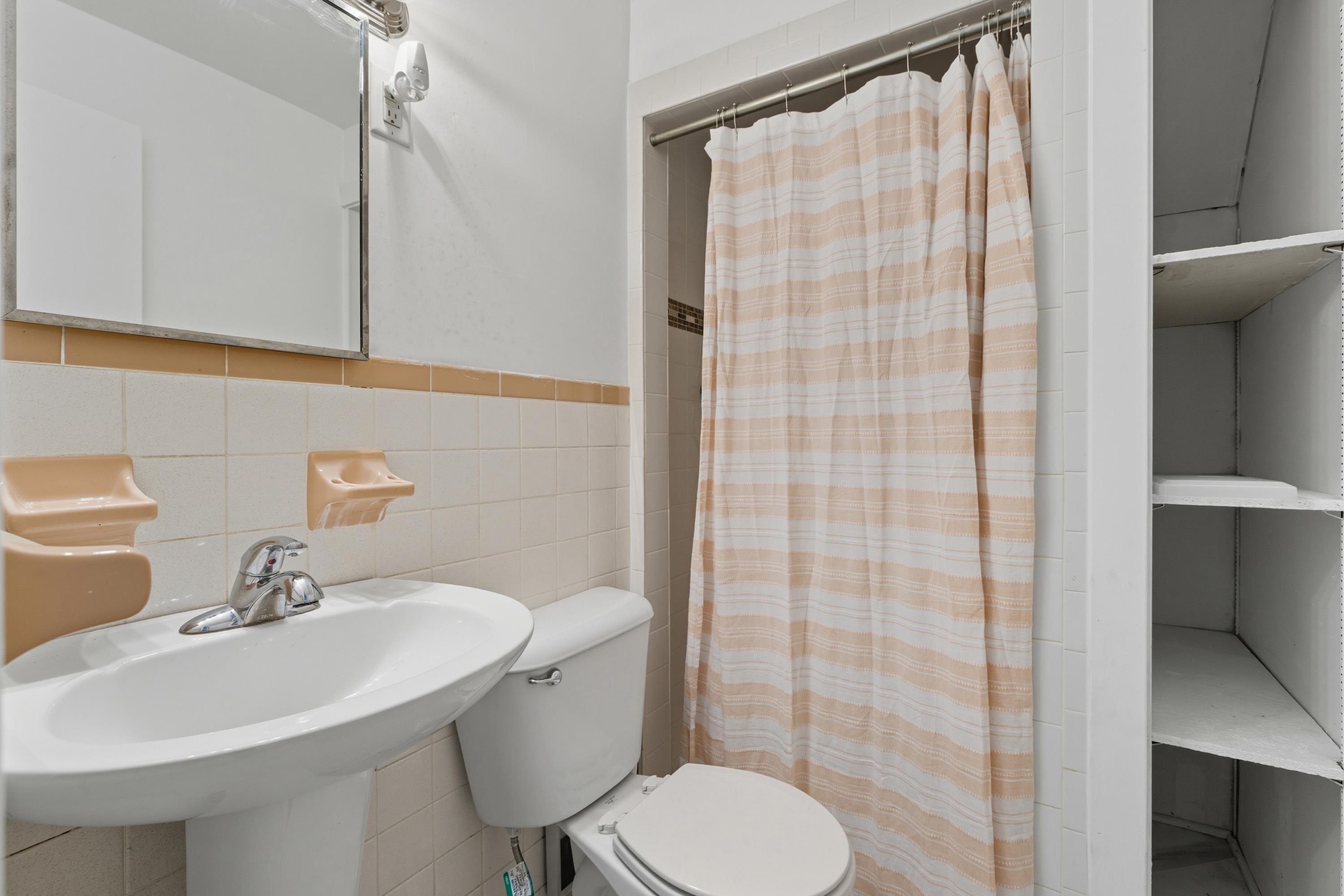 3138 Cross Keys Road Harrisonburg, VA 22801 - Photo 49 of 74 This second full bathroom features a stand-up shower space and storage shelves.