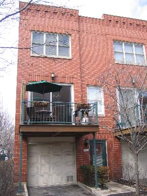 2801 North Wolcott Avenue, Unit S Chicago, IL 60657 - Photo 1 of 1 a front view of a building with many windows