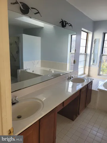 a white toilet sitting next to a bathroom sink