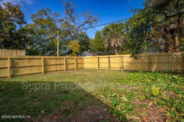 a view of backyard with green space