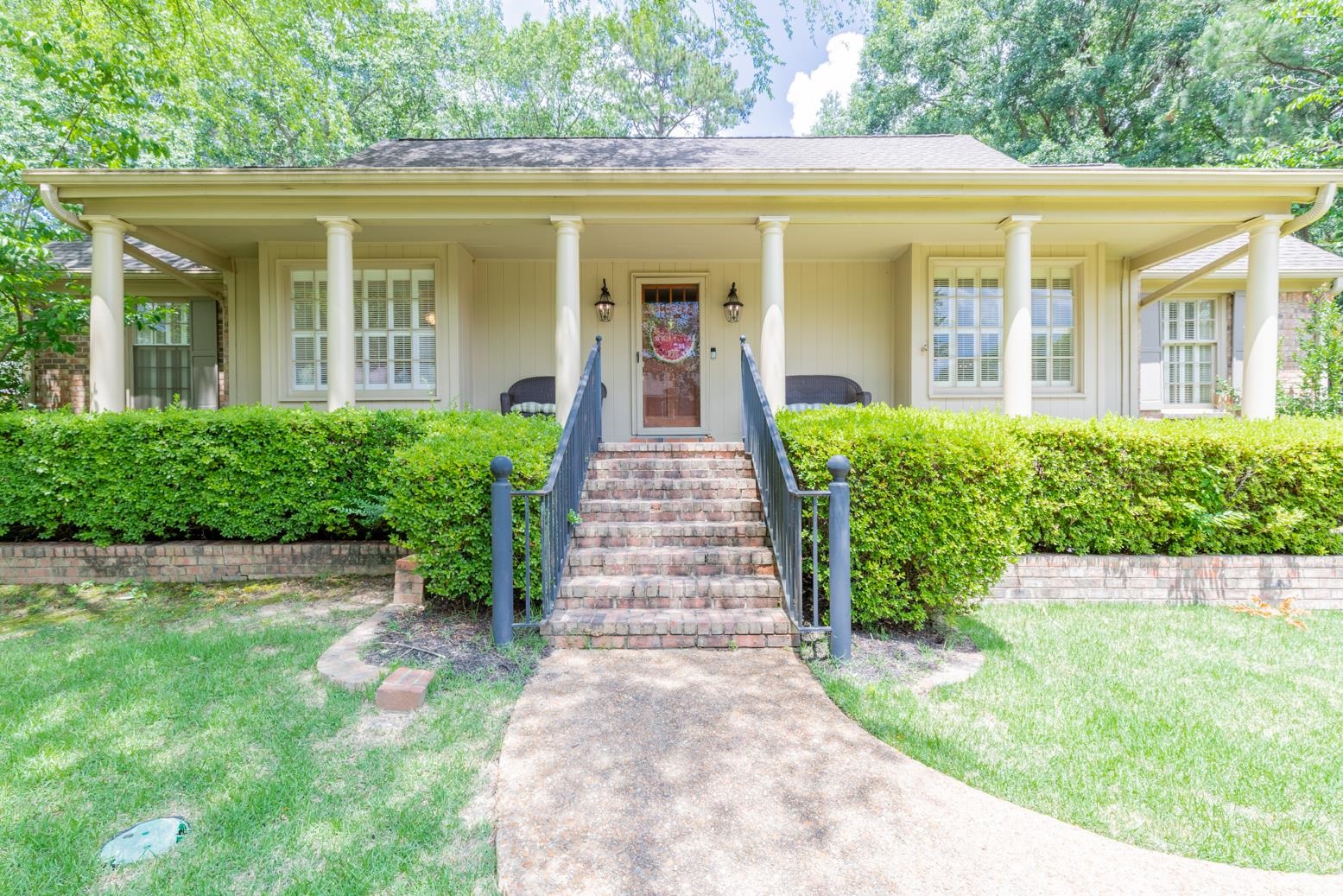 7140 River Reach Road Germantown, TN 38138 - Photo 1 of 25 front view of a house with a yard