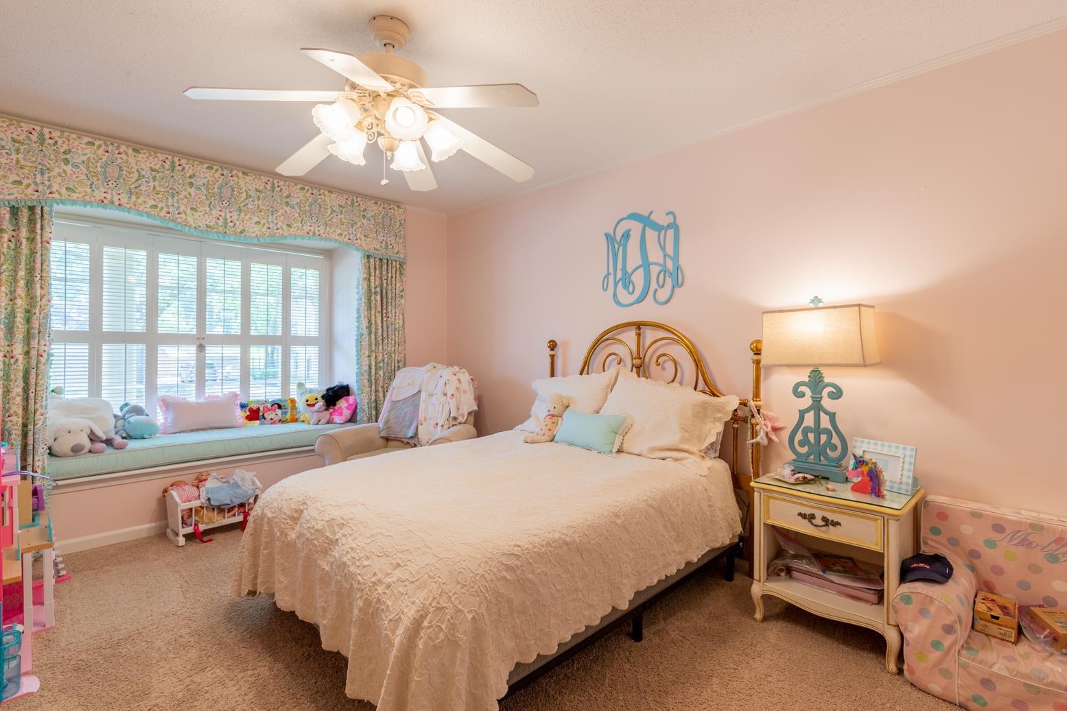 7140 River Reach Road Germantown, TN 38138 - Photo 14 of 25 a bedroom with a bed and a chandelier