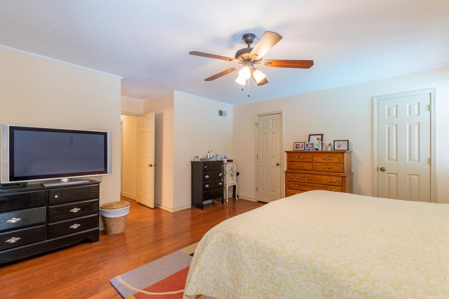 7140 River Reach Road Germantown, TN 38138 - Photo 18 of 25 a bedroom with a bed and a flat screen tv