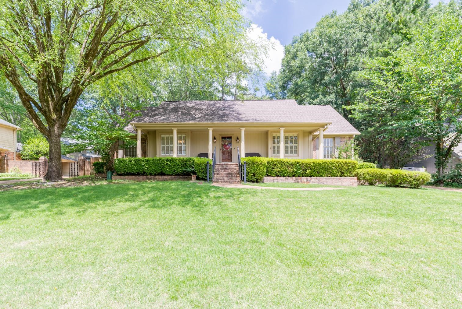 7140 River Reach Road Germantown, TN 38138 - Photo 2 of 25 a front view of a house with a yard