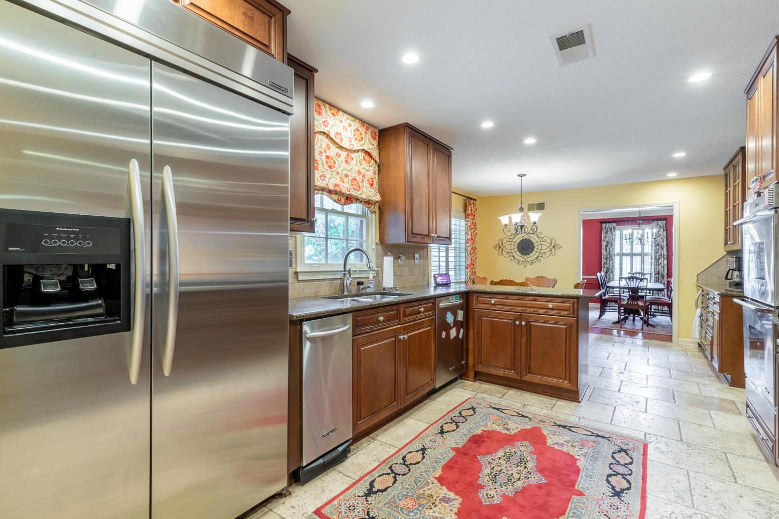7140 River Reach Road Germantown, TN 38138 - Photo 9 of 25 a kitchen with stainless steel appliances granite countertop a sink and cabinets